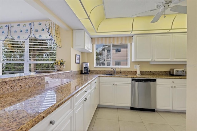 kitchen with ceiling fan, sink, light tile floors, white cabinets, and dishwasher