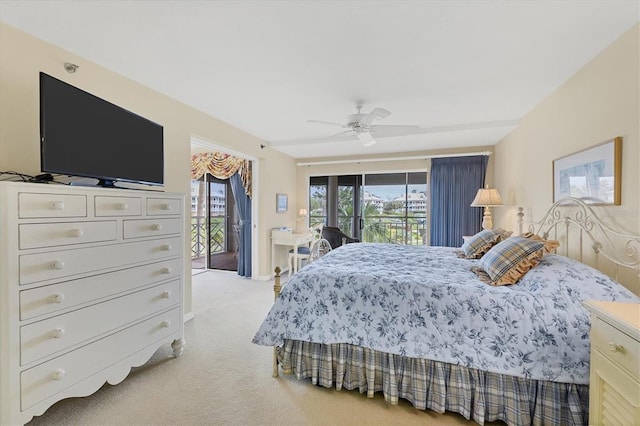 carpeted bedroom featuring ceiling fan and access to outside