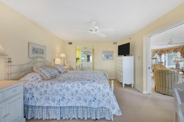 bedroom featuring light carpet and ceiling fan