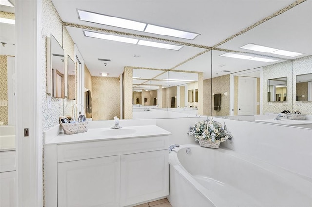 bathroom with tile flooring, a bathtub, and oversized vanity