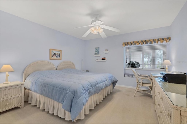 bedroom featuring light carpet and ceiling fan