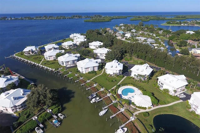 birds eye view of property with a water view