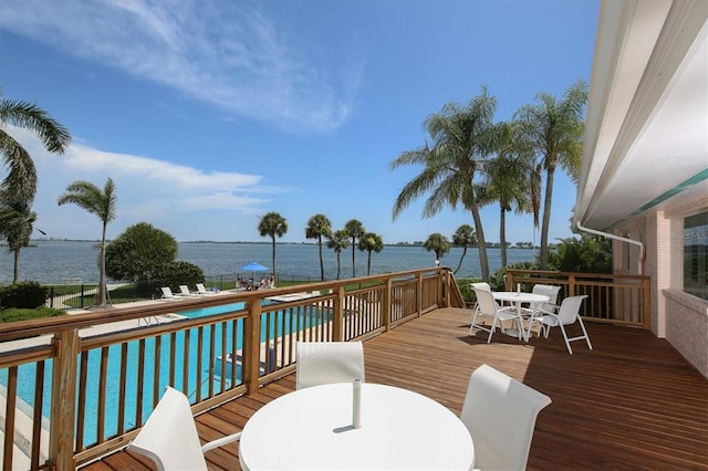 wooden deck featuring a water view