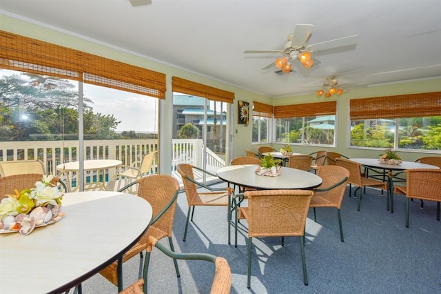 sunroom / solarium with ceiling fan