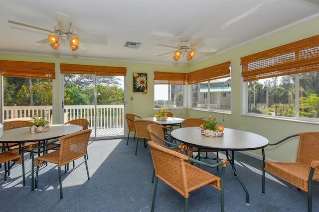 sunroom featuring plenty of natural light and ceiling fan