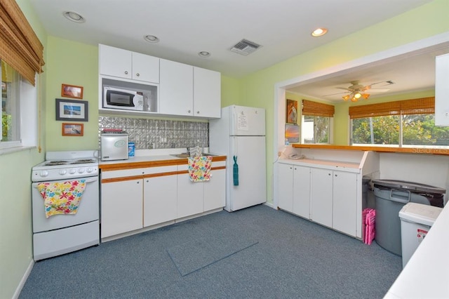 kitchen with ceiling fan, white appliances, and white cabinetry