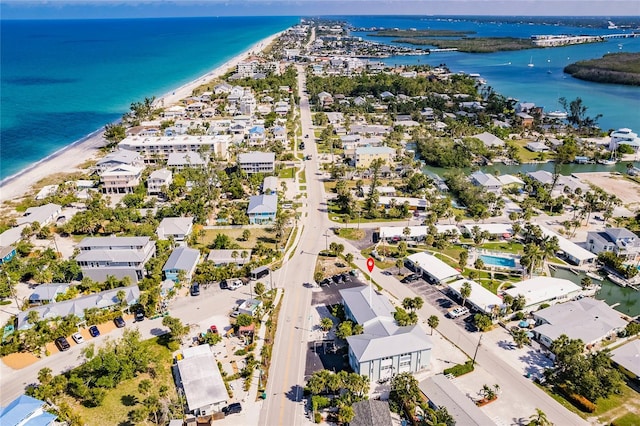 aerial view with a view of the beach and a water view