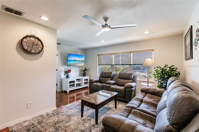 living room with ceiling fan and hardwood / wood-style flooring