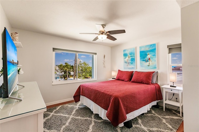 bedroom with wood-type flooring and ceiling fan