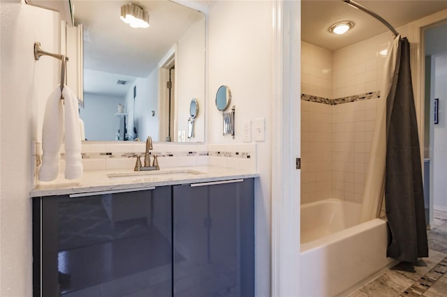 bathroom featuring tile floors, shower / bath combination with curtain, and vanity with extensive cabinet space