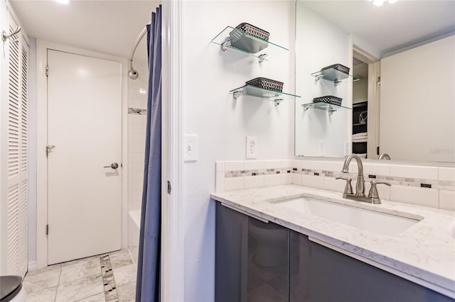 bathroom with shower / bathtub combination with curtain, tile flooring, tile walls, tasteful backsplash, and large vanity