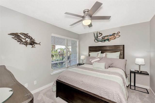 bedroom with light colored carpet and ceiling fan