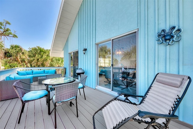 wooden deck featuring outdoor lounge area