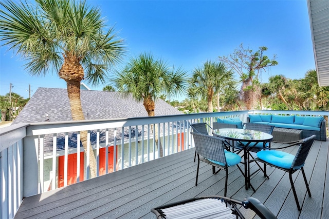 wooden deck with an outdoor hangout area