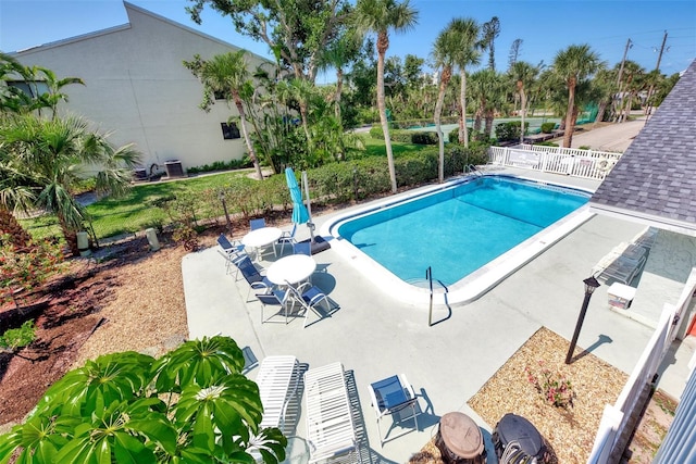 view of swimming pool featuring a patio area