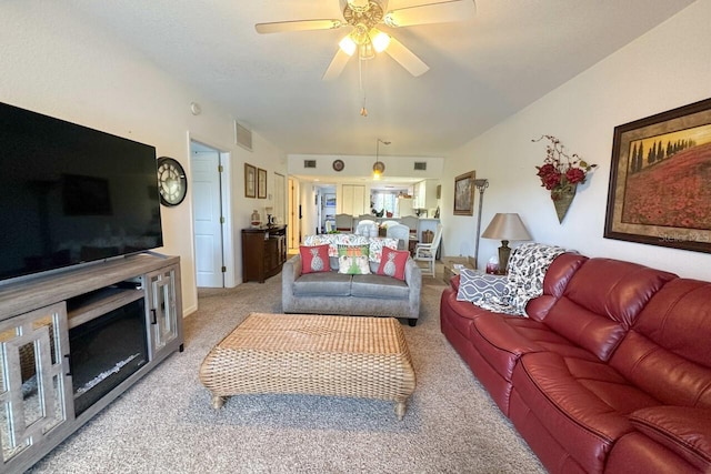 living room featuring ceiling fan and light colored carpet