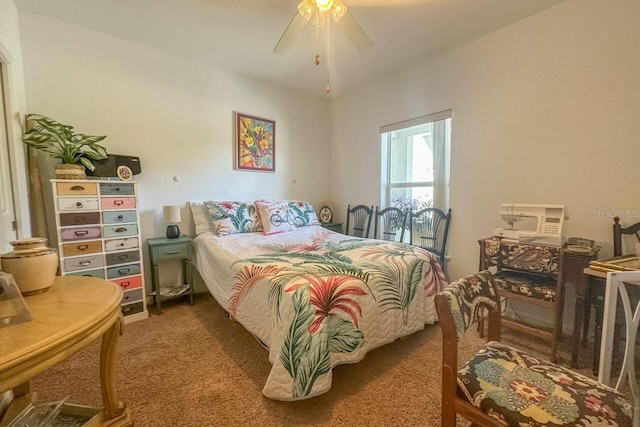 bedroom with dark carpet and ceiling fan