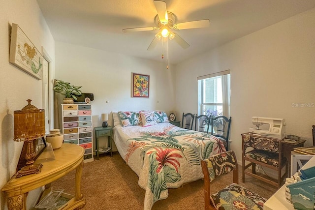 bedroom featuring ceiling fan and dark colored carpet