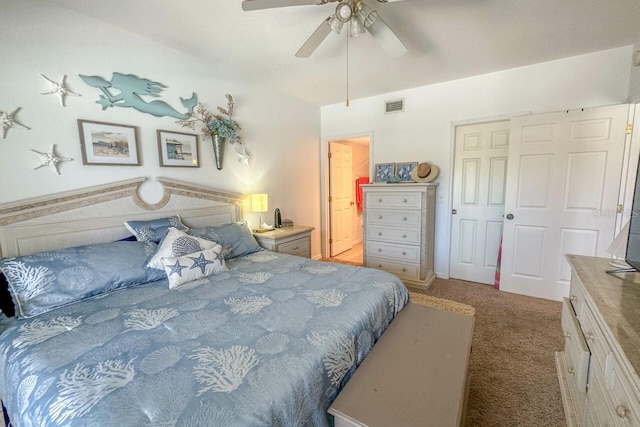 carpeted bedroom with a closet and ceiling fan