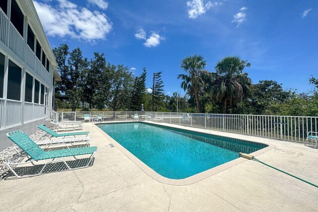 view of pool featuring a patio