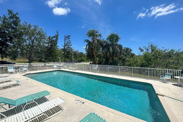 view of swimming pool with a patio