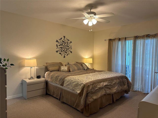 bedroom with carpet flooring, ceiling fan, and multiple windows