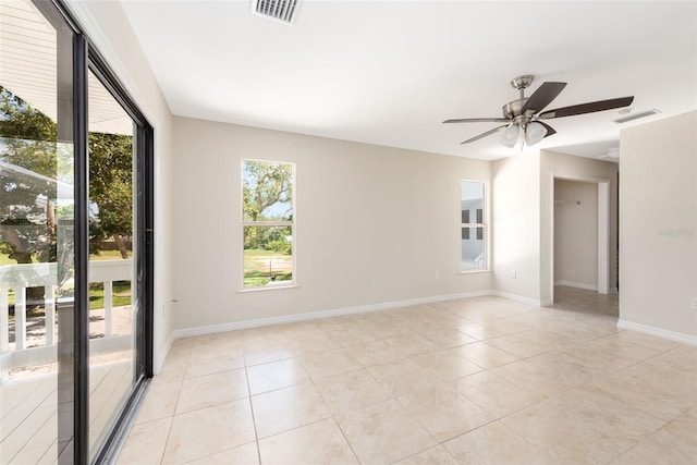 unfurnished room featuring ceiling fan and light tile floors