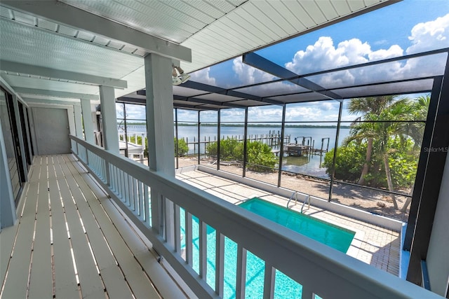 view of swimming pool with a water view