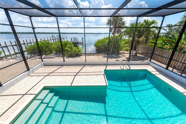 view of pool featuring a water view and a lanai