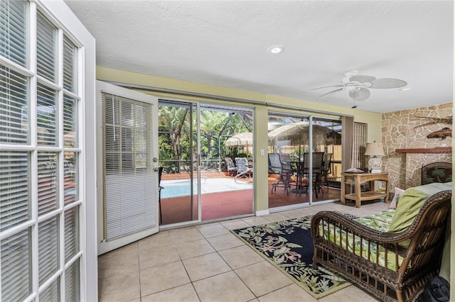 sunroom / solarium with ceiling fan