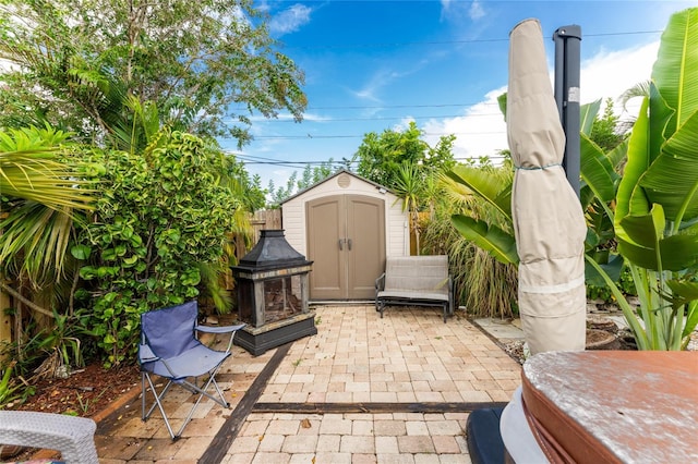 view of patio with a shed