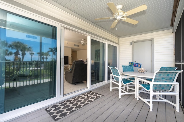 wooden deck with ceiling fan