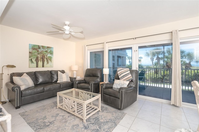 tiled living room featuring ceiling fan