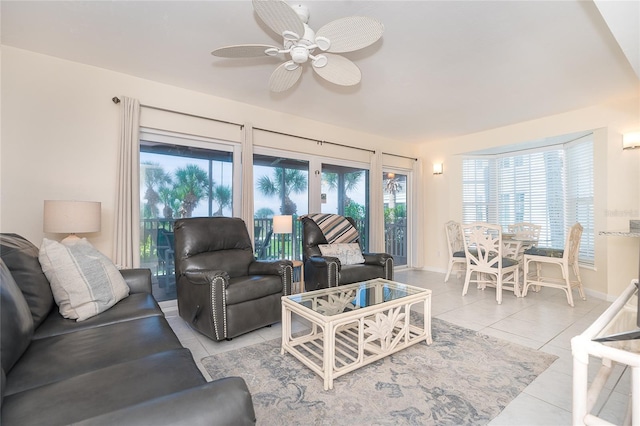 tiled living room with ceiling fan