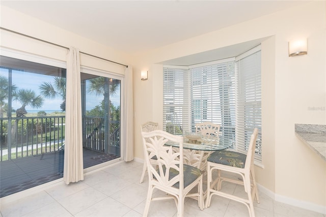 dining room featuring light tile floors