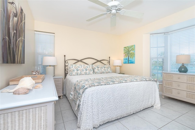 tiled bedroom with ceiling fan