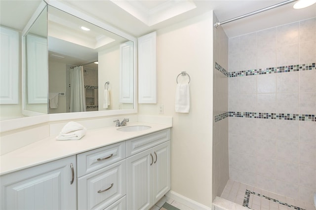 bathroom featuring vanity, a tray ceiling, tile flooring, a shower with shower curtain, and ornamental molding