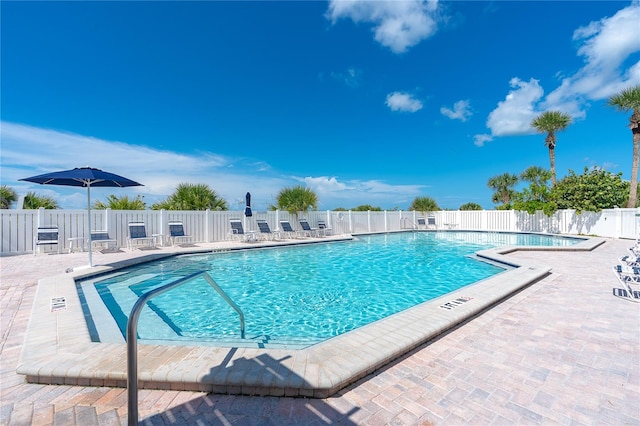 view of swimming pool featuring a patio area