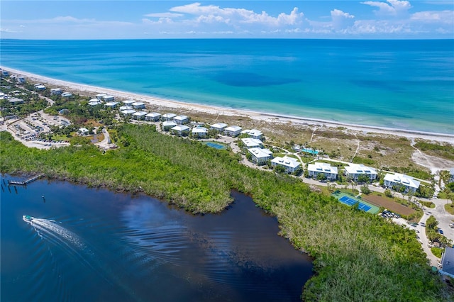 bird's eye view featuring a beach view and a water view