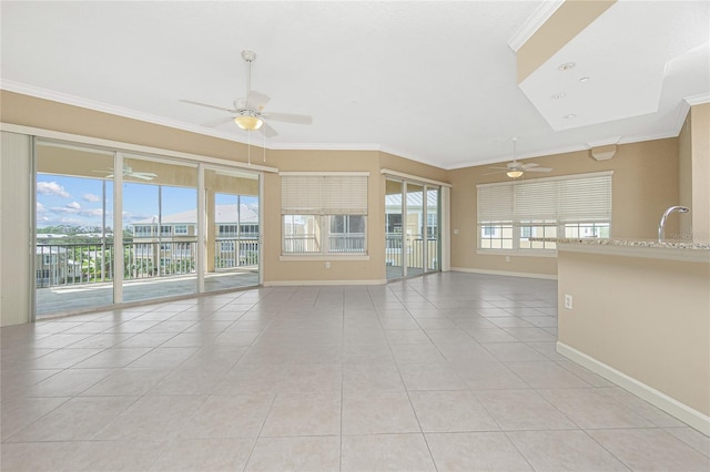 unfurnished living room with crown molding, ceiling fan, and light tile floors