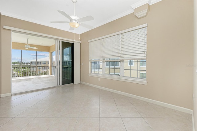 spare room featuring light tile flooring, plenty of natural light, ornamental molding, and ceiling fan