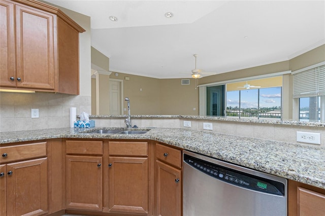 kitchen with backsplash, ceiling fan, sink, light stone counters, and dishwasher