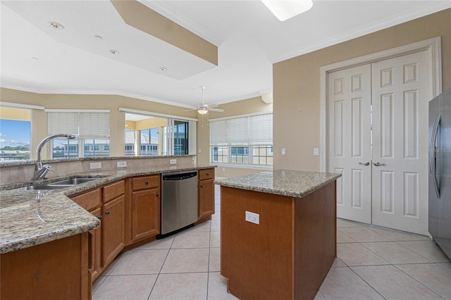 kitchen with a center island, ceiling fan, a wealth of natural light, and stainless steel appliances