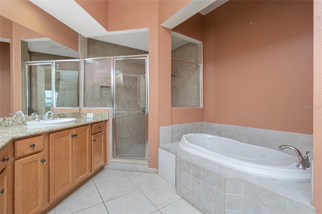 bathroom featuring shower with separate bathtub, vanity, and tile flooring