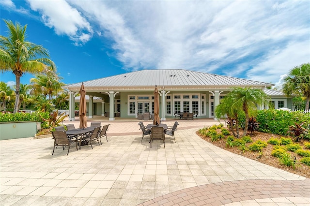 back of property with a patio and french doors