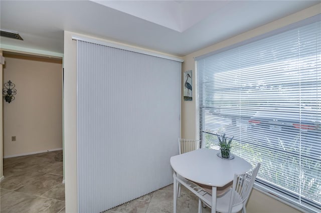 dining room with light tile floors