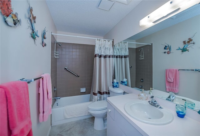 full bathroom with toilet, shower / bath combo with shower curtain, tile floors, oversized vanity, and a textured ceiling