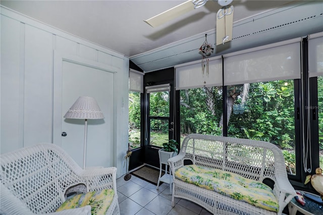 sunroom with lofted ceiling and ceiling fan