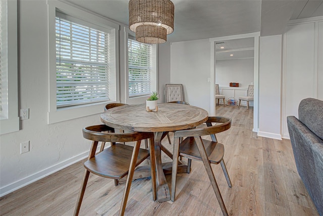 dining area with a healthy amount of sunlight and light wood-type flooring