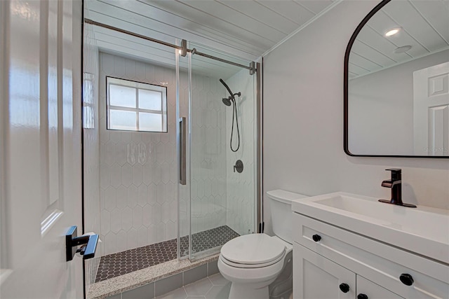 bathroom with an enclosed shower, tile flooring, vanity with extensive cabinet space, toilet, and ornamental molding